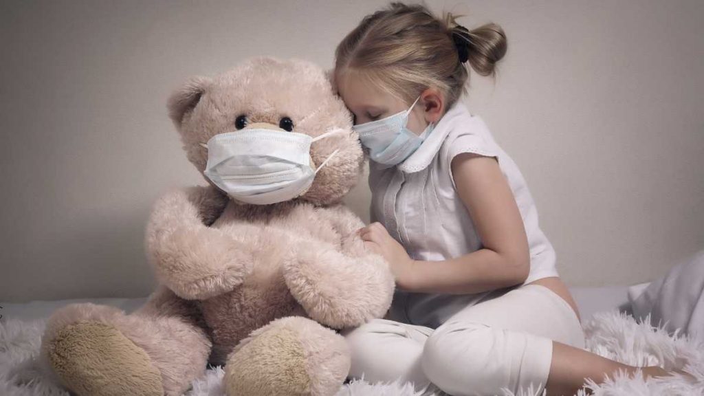 toddler showing empathy to her bear