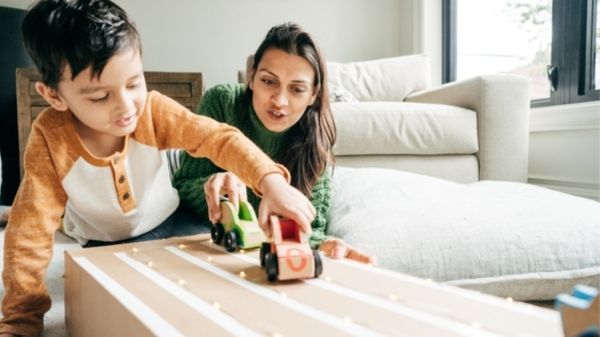 mom playing a game with her toddler