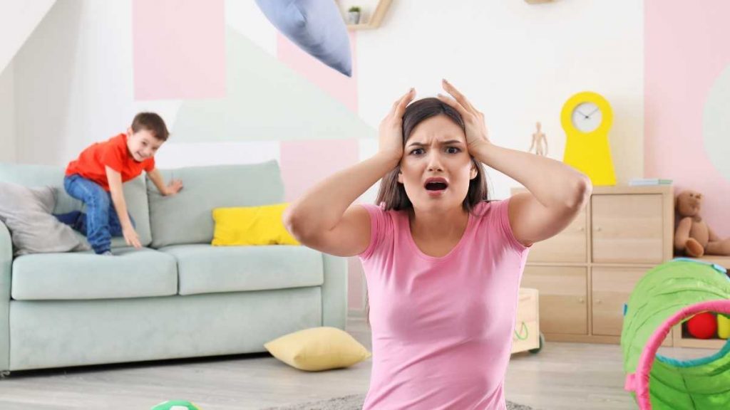 mom not disciplining child bouncing on sofa