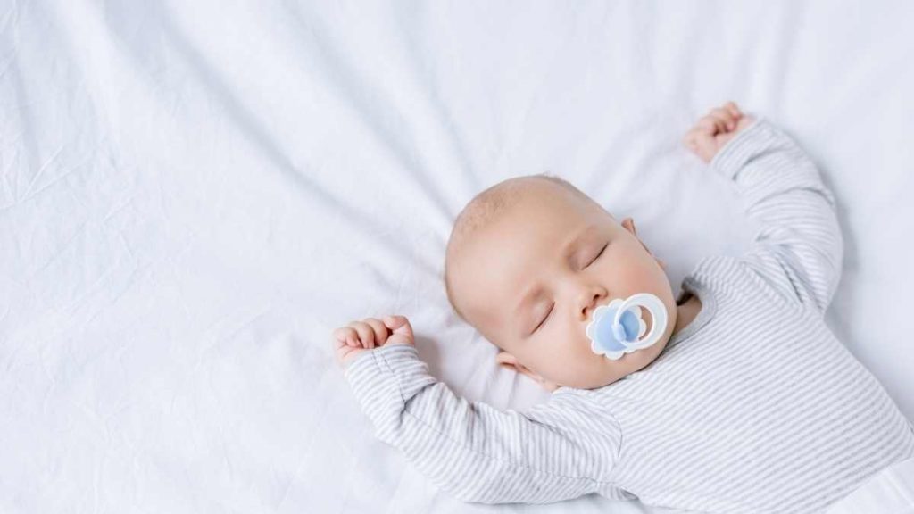 baby sleeping with pacifier