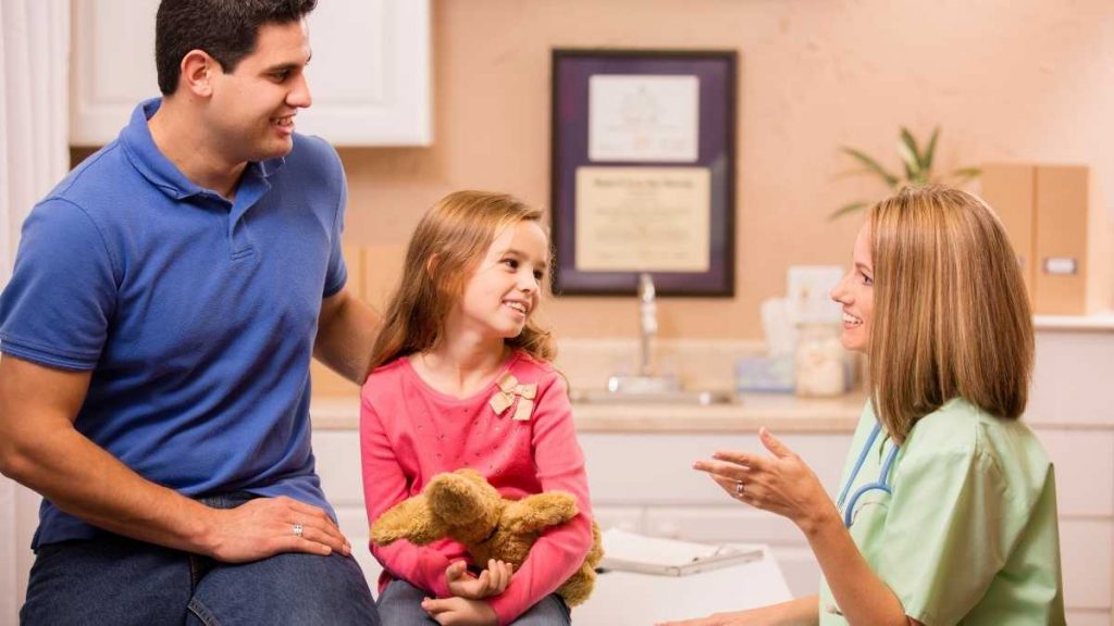 mom and dad talking to their daughter about school