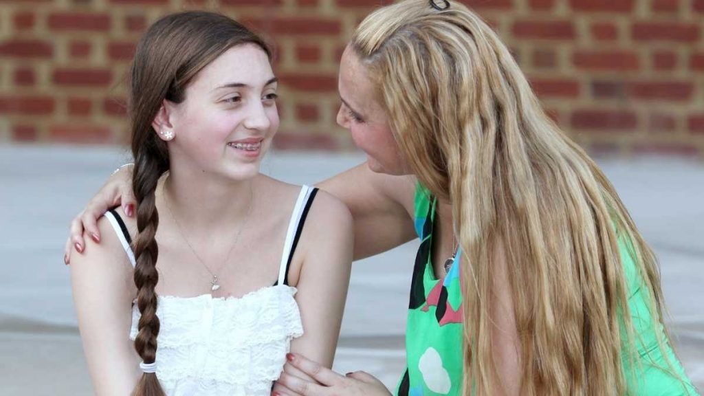 mom talking to her daughter about school work