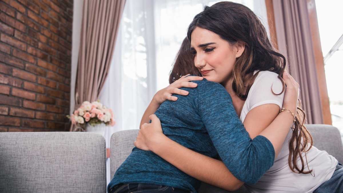 two girls hugging showing empathy