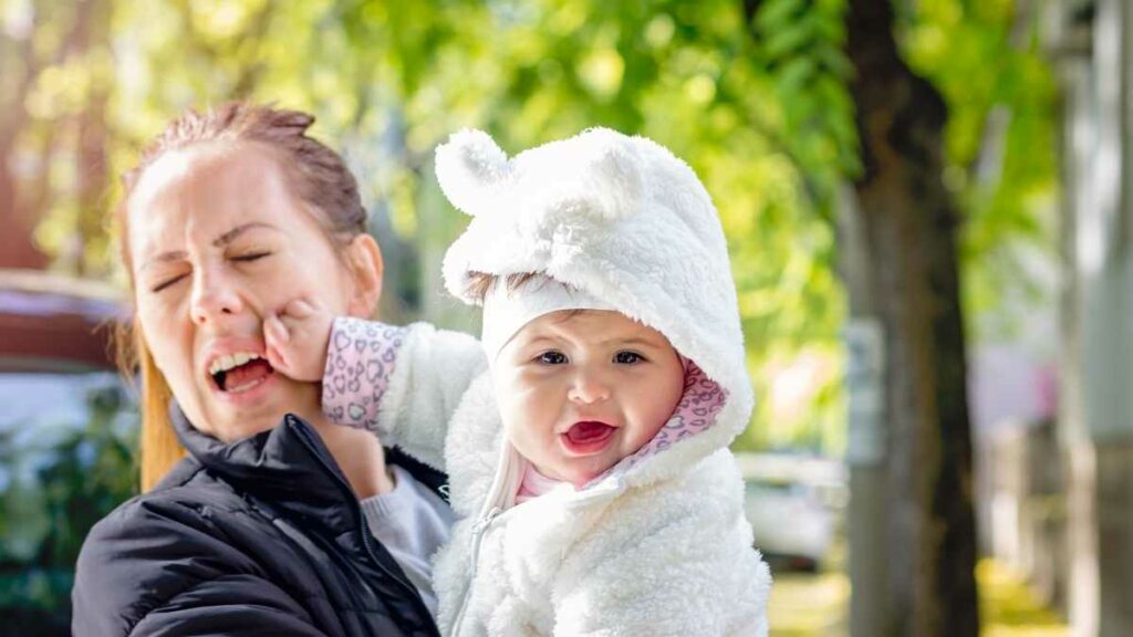 baby punching mommy