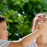child punching sibling