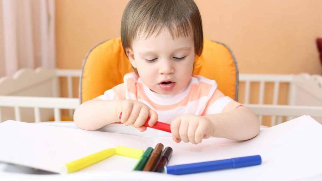 18 month old playing with crayons