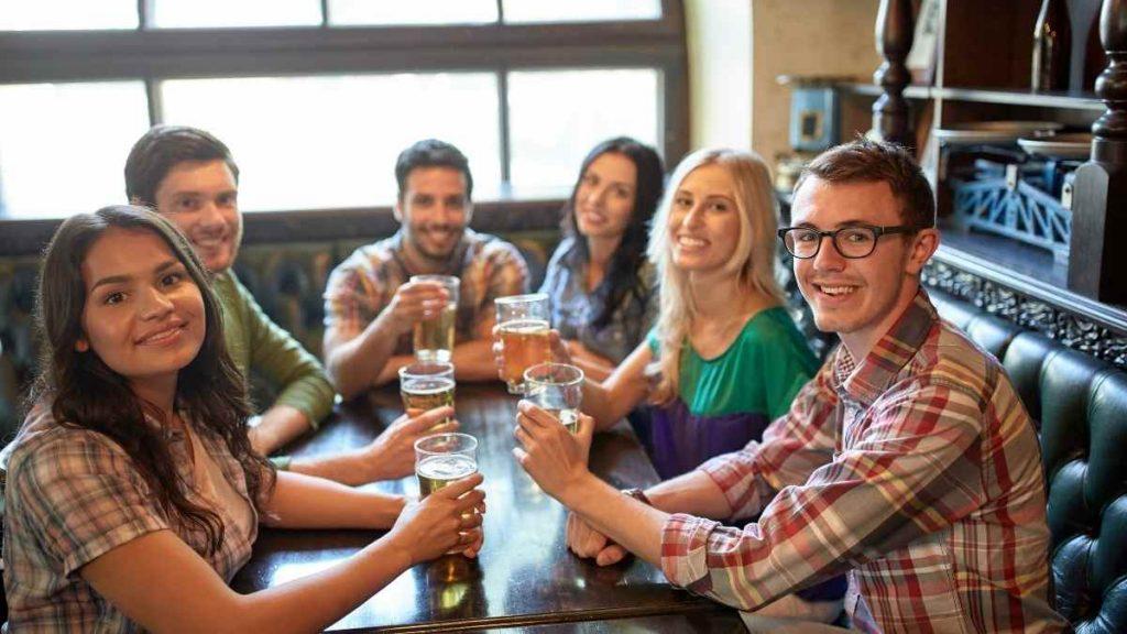 group of adults enjoying a beer