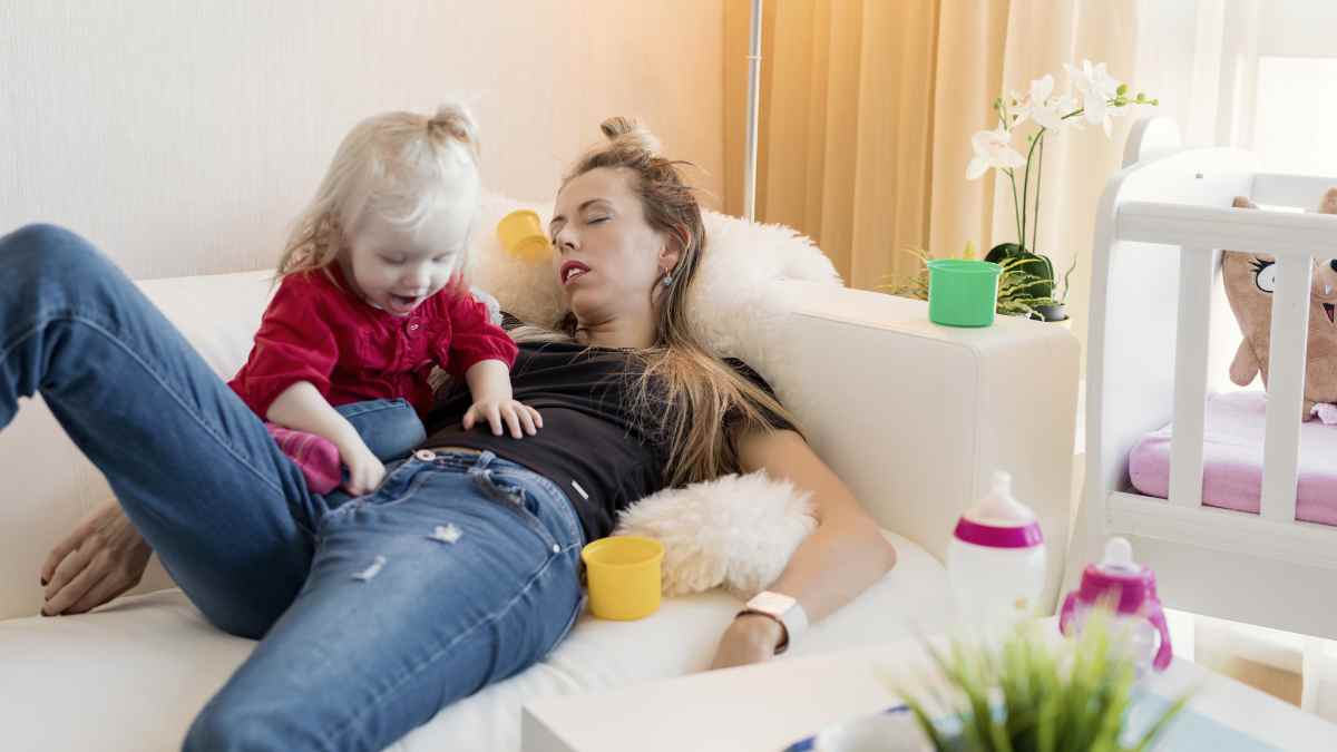 toddler wakes up too early tired mom on couch