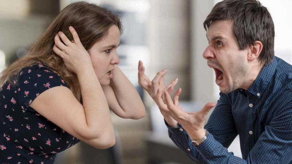 man shouting at woman